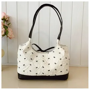 Elegant Korean style textured white underarm shoulder bag with black bow patterns