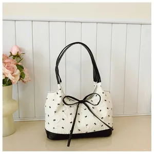 Korean style white underarm shoulder bag with black bow patterns and large bow detail