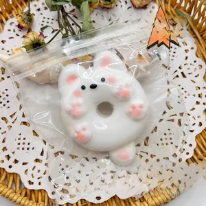 Adorable white puppy dog donut squishy toy for stress relief in clear packaging