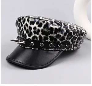 Punk style leopard print flat top hat featuring silver metal spikes and leather brim