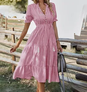 Detailed view of a pink striped V-neck summer dress with tiered ruffle skirt.