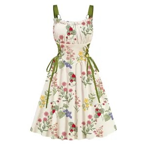 Floral print vacation dress with strawberry pattern and metal ring lace-up waist detail.