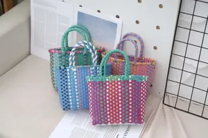 Colorful plastic woven tote bags featuring vibrant contrast striped patterns and sturdy handles