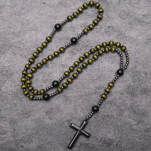 Detailed view of handcrafted wood and black hematite bead rosary necklace with cross