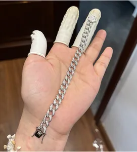 Detailed view of a 925 silver cuban link bracelet with sparkling moissanite stones