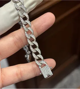 Macro shot of sterling silver Cuban link bracelet encrusted with moissanite diamonds