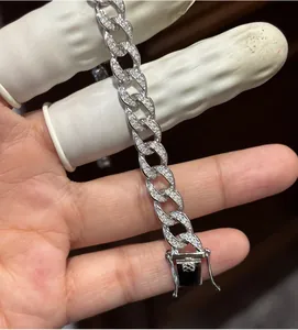 Macro view of a 925 sterling silver Cuban link bracelet with sparkling moissanite stones