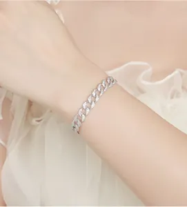 Detail view of a premium 925 sterling silver Cuban link bracelet with moissanite stones