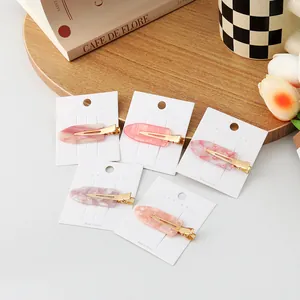 Set of cherry blossom pink acetate hair clips with simple gold-tone duckbill metal base