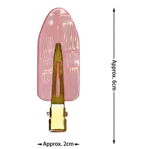 Cherry blossom pink non-marking hair clip with textured acrylic top and gold metal base