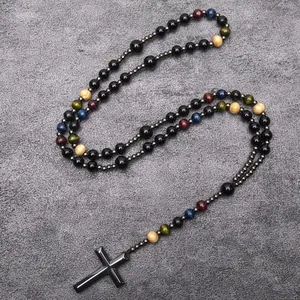 Long religious rosary necklace with hematite stone beads and a black cross pendant