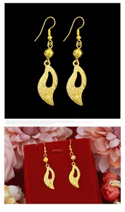 Elegant long gold sand hook earrings with star engraving and leaf shaped pendant
