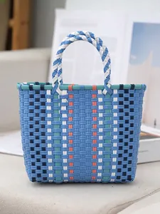 Stylish color-blocked woven tote bag with durable plastic weave for beach and shopping