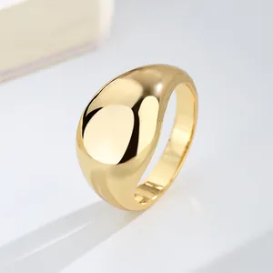 Minimalist polished gold-tone chunky dome ring with a smooth glossy finish for women