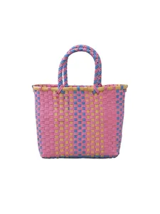 Stylish colorful hand-woven plastic tote bag for women in pink, blue and yellow hues