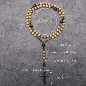 Long religious rosary necklace with wood beads, hematite stones, and cross pendant.