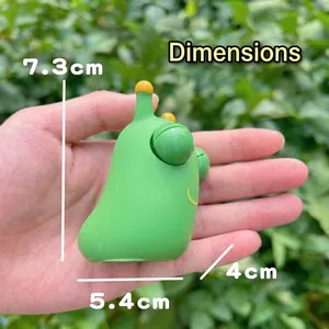 Cute green caterpillar decompression toy with bulging eyes and 7.3cm height dimension.