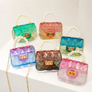 Detailed display of various mini gradient jelly bags with pearl handles.