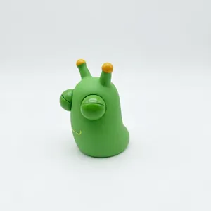 Close-up of a green pop-eye caterpillar stress relief toy isolated on a white background
