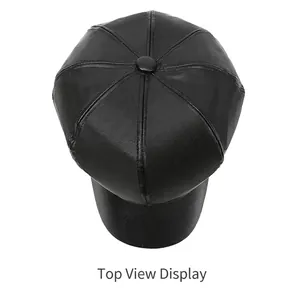 Top view showing the eight-panel construction of a retro black PU leather newsboy cap