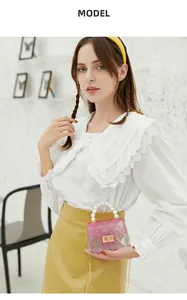 Asian model showcasing a stylish mini gradient jelly bag with pearl handle and gold chain