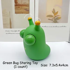 Close-up detail of a cute green pop-eye worm squeeze toy designed for stress relief