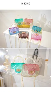 Macro view of mini gradient jelly bags with pearl handles and gold chain straps