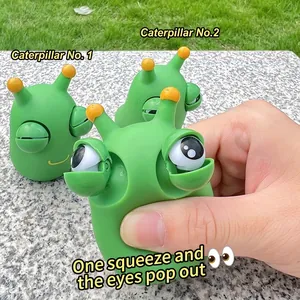 Close-up detail showing the pop-eye feature of a green caterpillar squeeze decompression toy