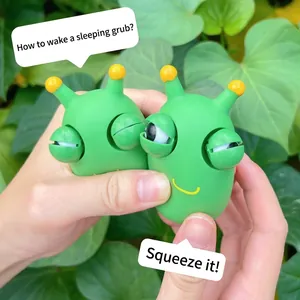 Close-up of green cabbage worm squeeze toy with pop-out eyes for stress relief.