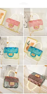 Detailed view of mini gradient jelly bags with pearl handles and gold chains