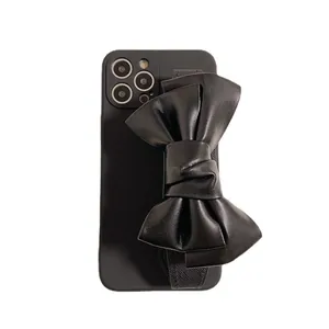 Premium black leather bow wristband case for iPhone 17 Pro Max, elegant fashion accessory