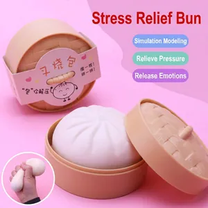 Detail view of realistic steamed bun squishy toy in a mini plastic steamer basket