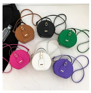 Detailed view of fashionable small round quilted crossbody bags in six vibrant colors