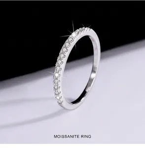 Detail view of sparkling moissanite stones on an S925 silver band.