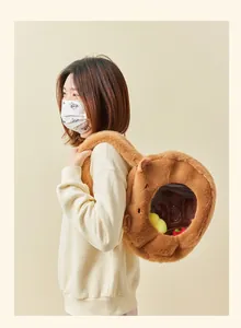 Detailed view of an Asian model wearing a cute brown furry capybara plush shoulder bag