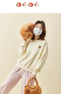 Adorable Capybara plush shoulder bag and matching plush toy shown in a model shot