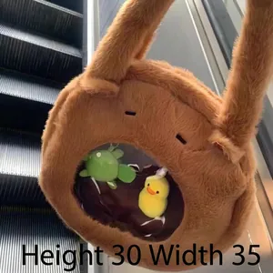 Detail view of cute Capybara plush bag with a transparent window showing small plush toys