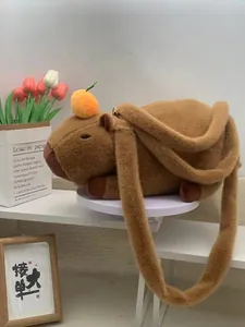 Close-up of the cute brown plush capybara shoulder bag with 20x30cm size markings