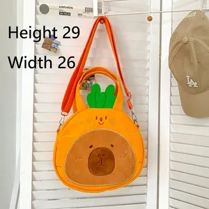 Detail view of carrot-shaped Capybara plush bag with height 29cm and width 26cm