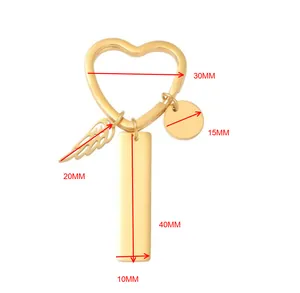 Detailed size chart for a gold heart-shaped keychain with wing and bar pendant charms
