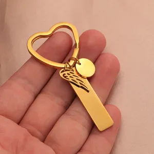 Minimalist gold stainless steel heart keychain with wing and engravable rectangular bar