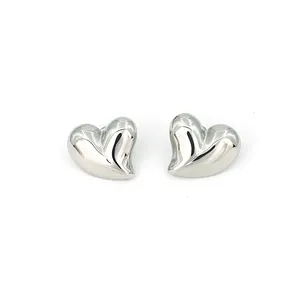 Detailed close-up of polished silver heart-shaped stainless steel stud earrings.