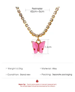 Close-up of pink butterfly pendant necklace with rhinestone chain and measurements.