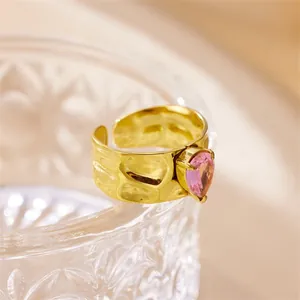 18k gold plated stainless steel ring with hammered texture and pink heart zircon