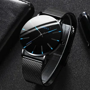 Close-up detail of a men's business watch with blue needles and black mesh strap