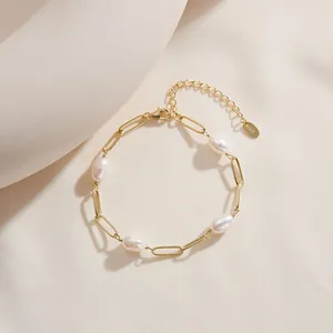 Close-up of S925 gold-plated paperclip chain bracelet with natural baroque pearls.