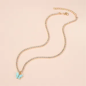 Elegant gold-toned clavicle chain necklace with a light blue butterfly pendant