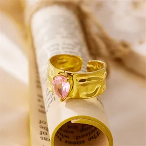 Vintage hammered 18K gold plated stainless steel ring with a pink teardrop zircon