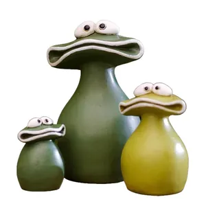 Set of three quirky green resin frog figurines for outdoor garden and home desk decor.