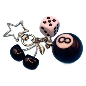 Stylish cherry metal keychain featuring pink dice and 8-ball pendant for bag or car keys